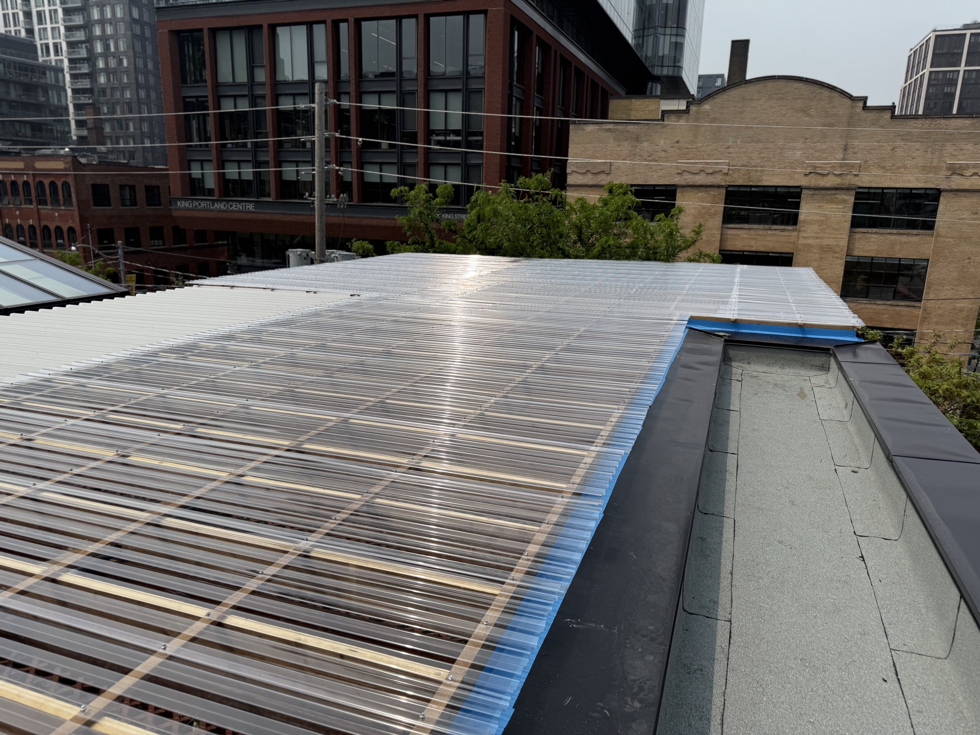 Finished clear-roof cover over the rooftop patio