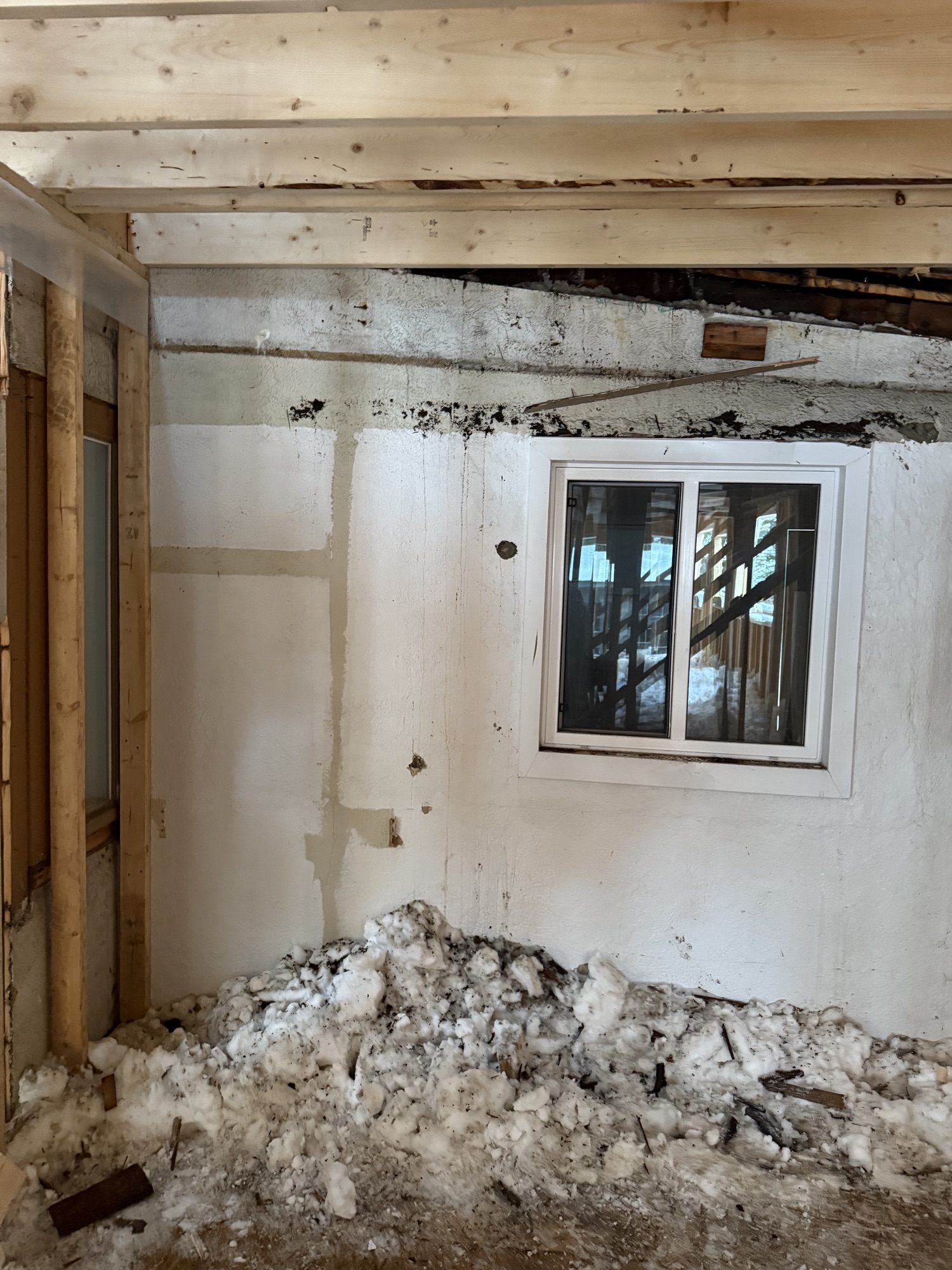 Interior stripped to the framing, mid-demolition