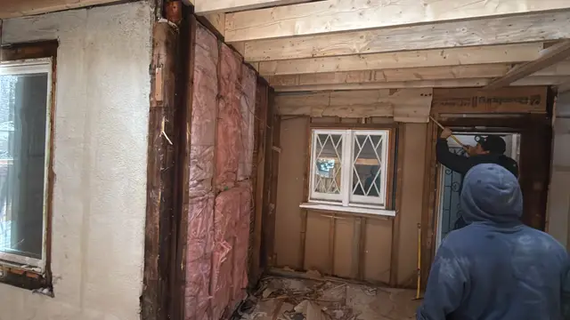 Walls opened up — pulling trim and insulation