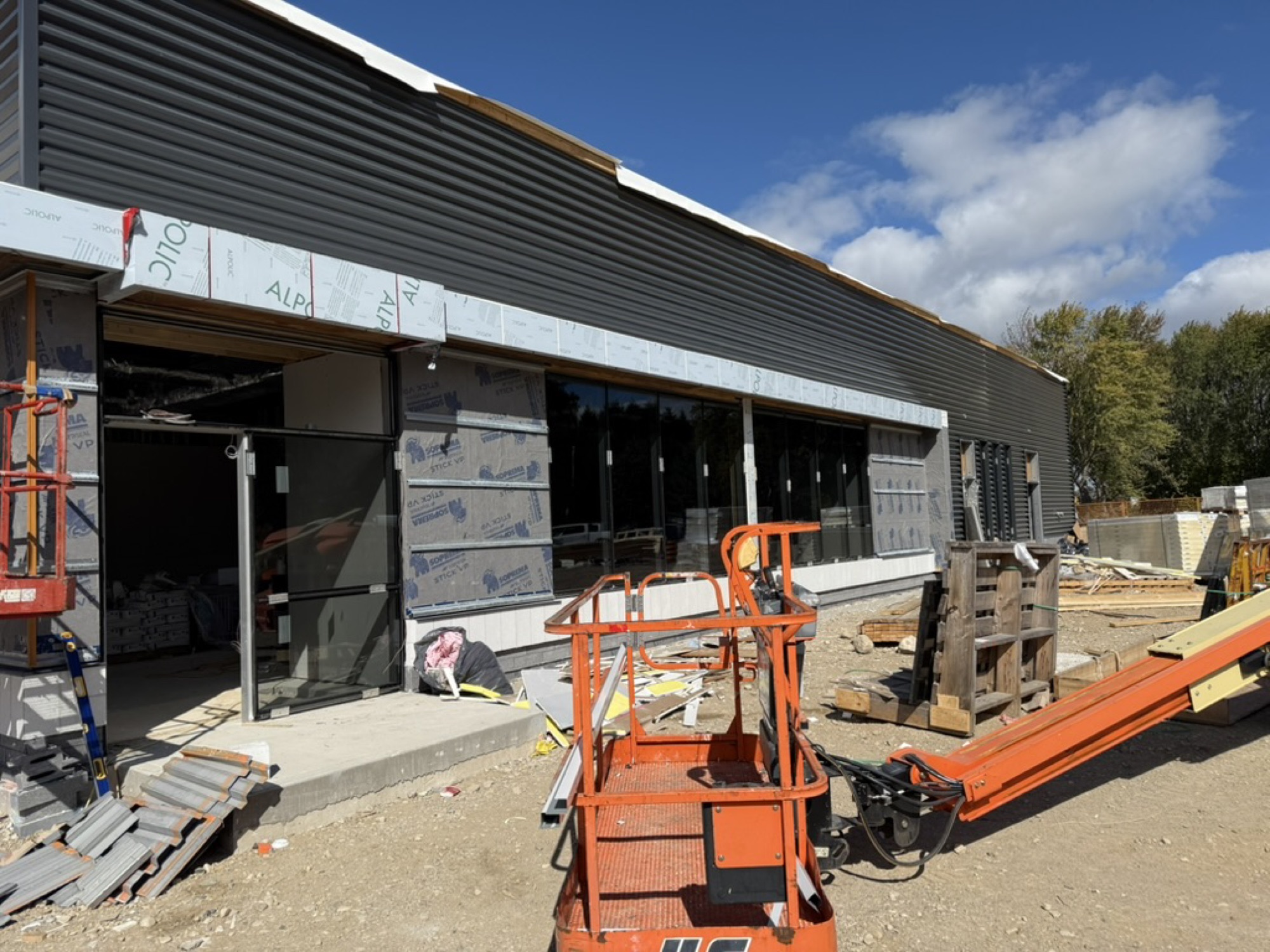 Elora — metal cladding and storefront glazing going up