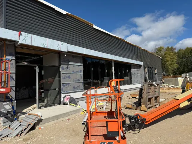 Elora — metal cladding and storefront glazing going up