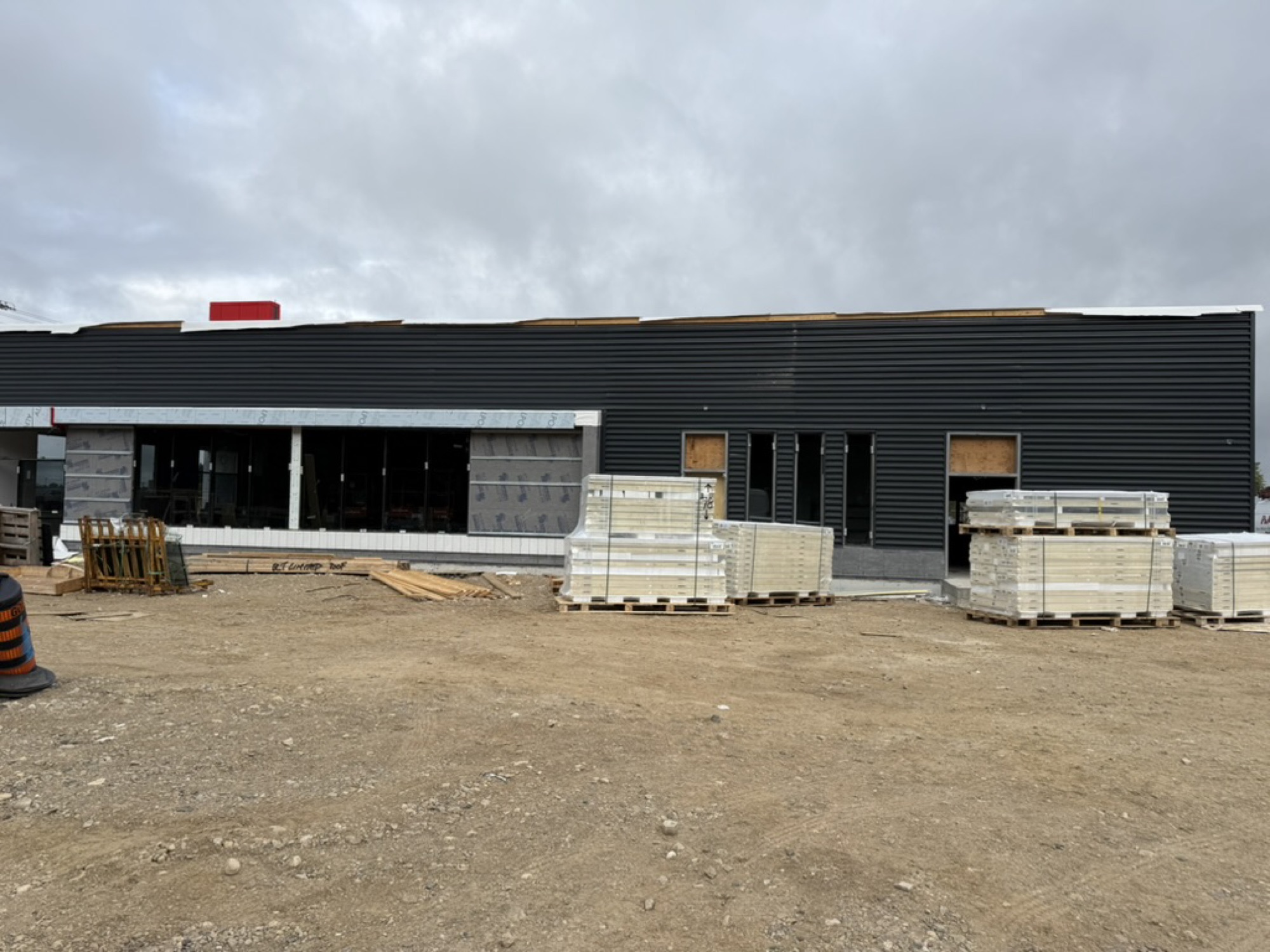 Elora — cladding and storefront glazing installed