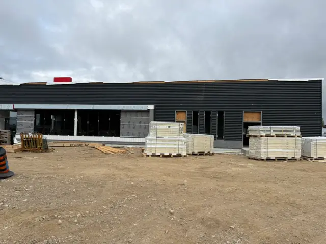 Elora — cladding and storefront glazing installed