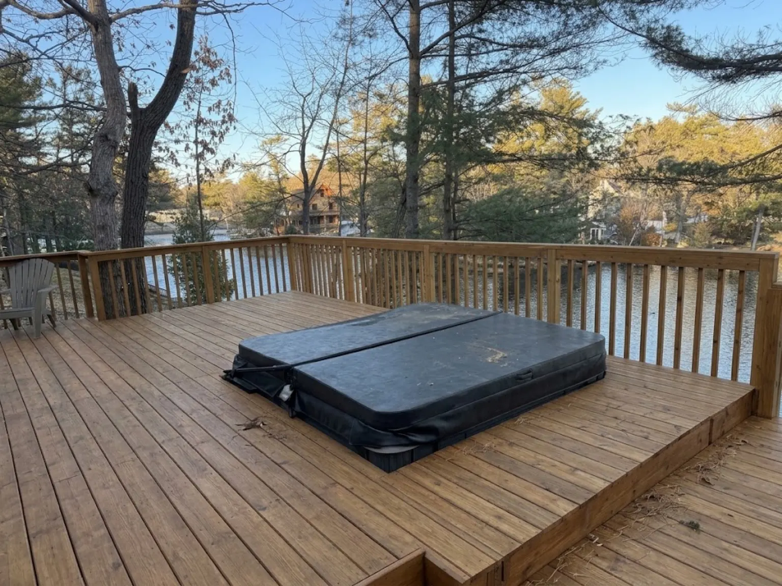 Finished multi-level cedar deck overlooking the lake, with a hot tub