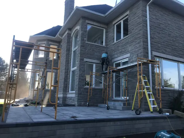Orangeville — scaffolding set up along the back of the house
