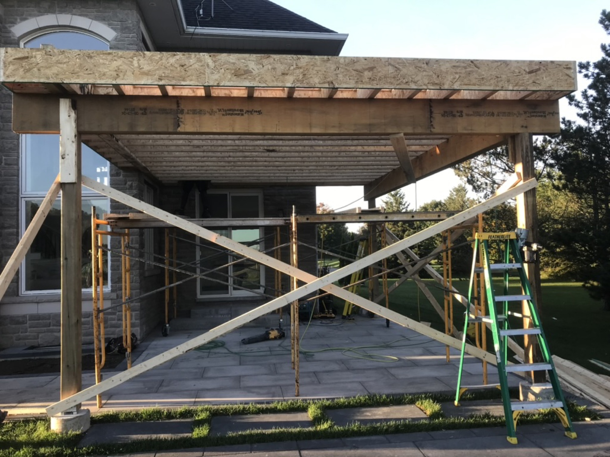 Orangeville — the raised deck frame and sheathing on temporary shoring